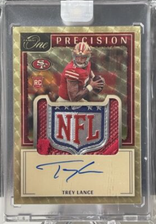 trey-lance-panini-one-gold-vinyl-nfl-shield-rpa.PNG